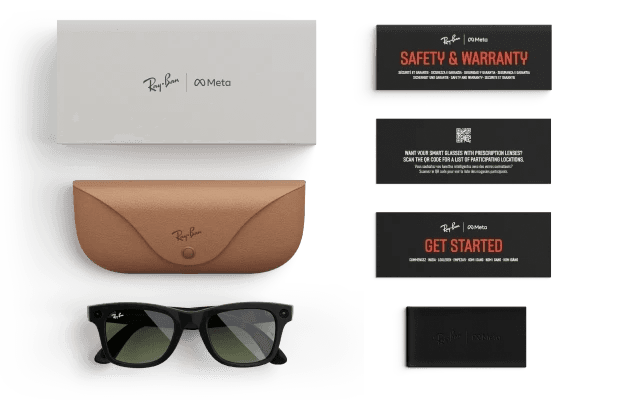 Ray-Ban Meta box contents laid out: the retail box, the tan charging case, the glasses, printed guides and a cleaning cloth