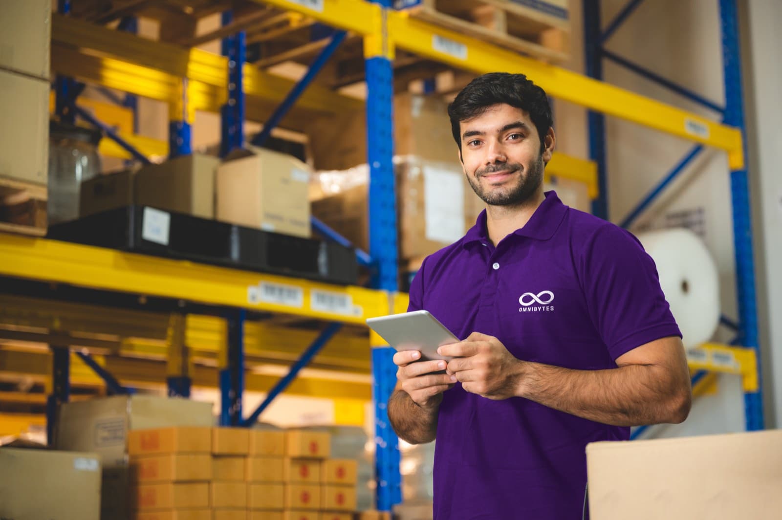 An A1 Tech Deals warehouse team member checking an order before dispatch